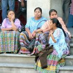 Local ladies in Sunday colors watching life go by