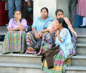 Local ladies in Sunday colors watching life go by