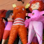 A pi????ata is a brightly-colored decoration made from either a