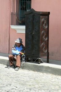 Old craftsman with his hand-made armoir