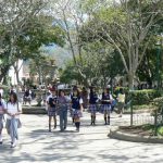 Schoolgirls on the way to school through Central Park