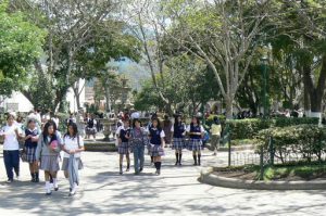 Schoolgirls on the way to school through Central Park