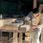 Carpenter at work on restoration