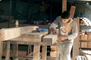 Carpenter at work on restoration