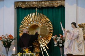 Monk during mass at Iglesia y Convento de San Francisco