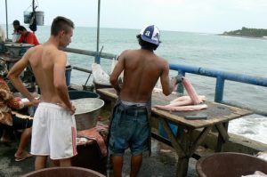 Customer waiting for fresh fish to be cut