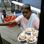 At various stops people come aboard the bus to sell