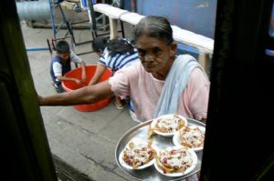 At various stops people come aboard the bus to sell