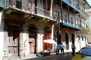 Unrestored and restored buildings stand next to each other