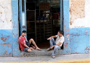 Local guys hanging out in front of a store