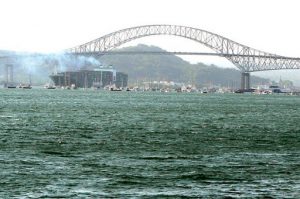 Cargo ship under the Bridge of the Americas