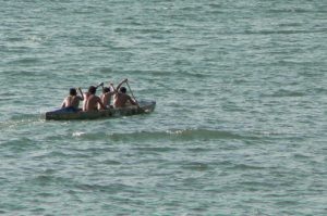 Rowing team in a dug-out canoe
