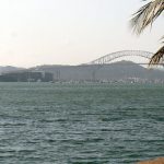 Cargo ship passing under the Bridge of the Americas