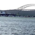 Cargo ship going north under the Bridge of the Americas