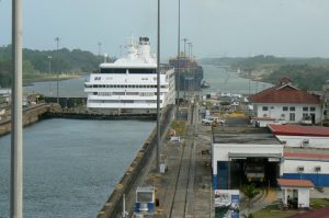 Cruise ship and cargo ship waiting to enter the first