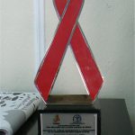 AIDS award to Oasis from the government for its education