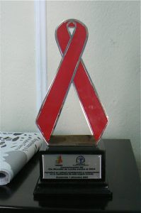 AIDS award to Oasis from the government for its education