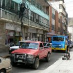 Typical narrow street, slow traffic, homeless wino and a thicket