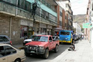 Typical narrow street, slow traffic, homeless wino and a thicket