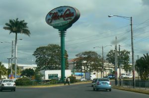 Tall advert sign for Flor de Cona in front of