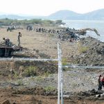 Diggers and scavengers along the polluted Lake Managua