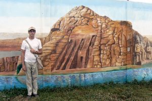 Michael in front of a Pharaoh's gambling casino mural