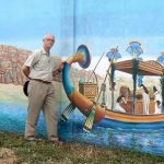 Richard in front of a Pharaoh's gambling casino mural