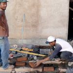 Repairing the sidewalk; Granada is well kept