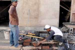 Repairing the sidewalk; Granada is well kept