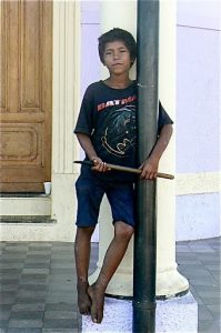 Homeless street boy, perhaps high on glue