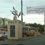 Political FSLN statue of fighter with gun and flag