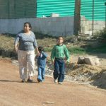 Mom and kids on the busy road to Lake Atitlan