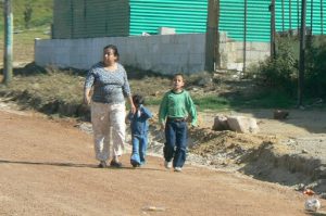 Mom and kids on the busy road to Lake Atitlan