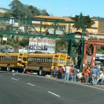 Old American school buses are used for local public
