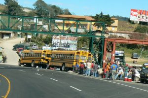 Old American school buses are used for local public