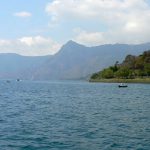 Along the shoreline of Lake Atitlan are high hills and