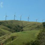 Departing from Arenal; wind farm in the hills