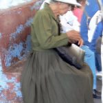 Elegant older woman waiting to cross the border