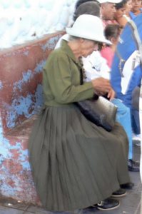 Elegant older woman waiting to cross the border