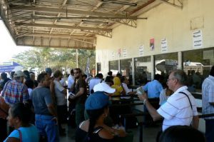 Waiting at customs crossing on NIcaragua border; money changer is