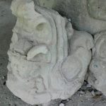 Displaced carved stone