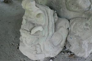 Displaced carved stone