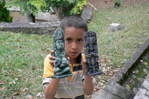 Local young vendor outside museum