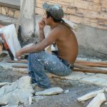 Local worker making sidewalk repairs