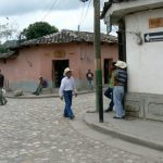 Streets are quiet and locals pass by