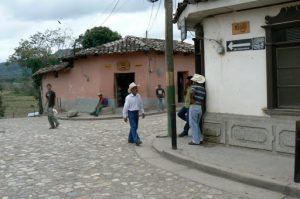 Streets are quiet and locals pass by