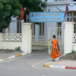 Monk passing National Library