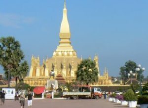 Pha That Luang national monument with statue of King Setthathirath