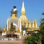 Pha That Luang national monument with statue of King Setthathirath