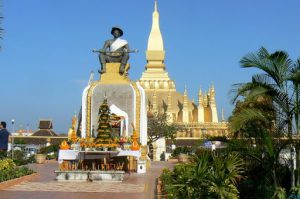 Pha That Luang national monument with statue of King Setthathirath